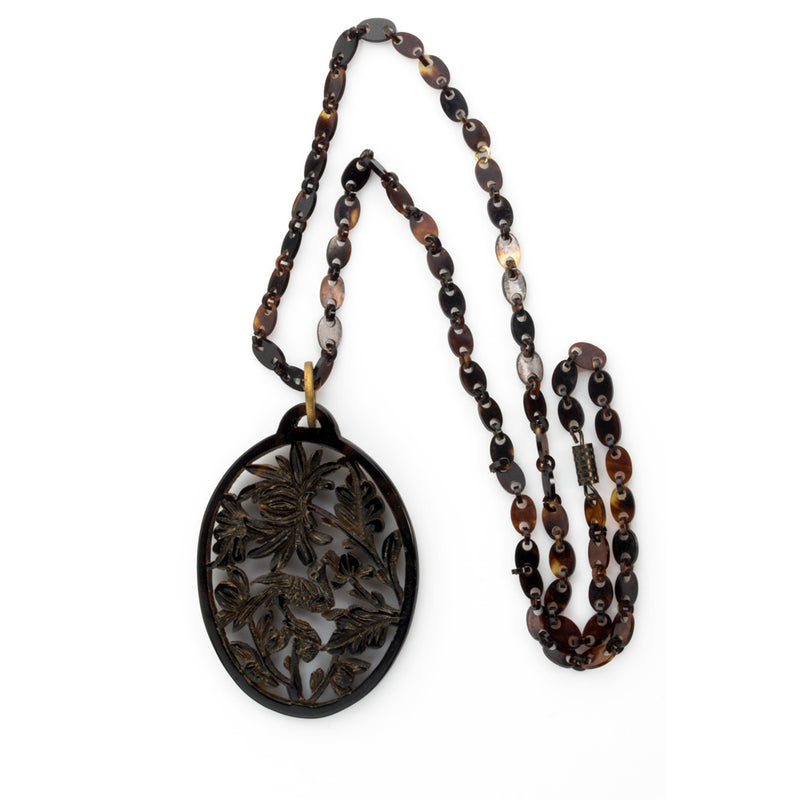 -Vintage carved openwork tortoise shell pendant on a tortoise shell link chain