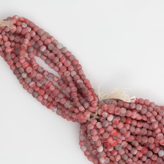 b17-256- Antique Bohemian smooth domed white and red nailheads, 3mm. Average 95 beads per strand.
