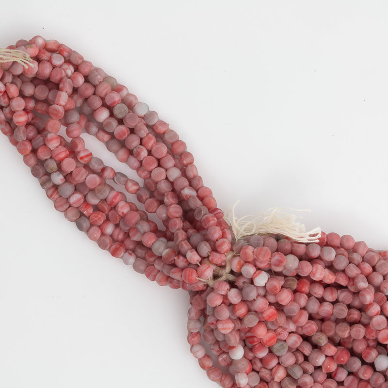Antique Bohemian smooth domed white and red nailheads, 3mm. Average 95 beads per strand.