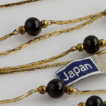 Vintage Japanese Brass Snake Chain with Black Glass and Brass Beads.  24" finished lengths. Sold individually. 