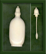 Vintage carved bottle with bottle top and spoon