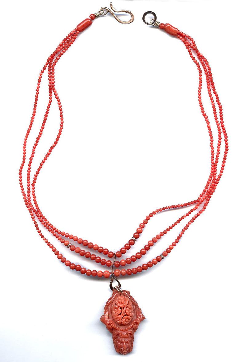 Rare Mediterranean salmon coral carving with an oval opal cabochon on the reverse, 14k rose gold metal work and a triple strand of coral beads