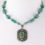 Art Deco lavalier brass and Peking Glass necklace. Czechoslovakia. 1920s.