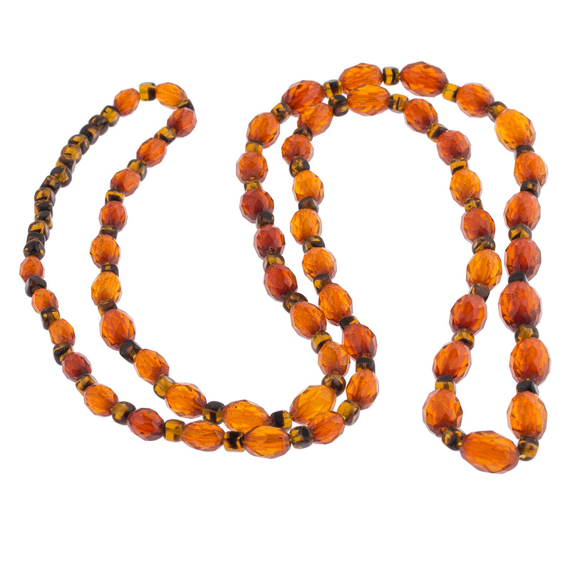 Antique Art Deco faceted Baltic amber bead necklace. Graduated.  35 inches.