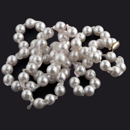 Semi-baroque Japanese Akoya Necklace, cultured 9mm pearls, 35 inches. 14kt clasp. C. 1950s. j-nlbd1273