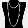 Necklace of vintage semi-baroque Japanese Akoya cultured 9mm pearls, 35 inches. 14k gold clasp. C. 1950s