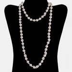 Necklace of vintage semi-baroque Japanese Akoya cultured 9mm pearls, 35 inches. 14k gold clasp. C. 1950s