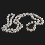 Necklace of vintage semi-baroque Japanese Akoya cultured 9mm pearls, 35 inches. 14k gold clasp. C. 1950s