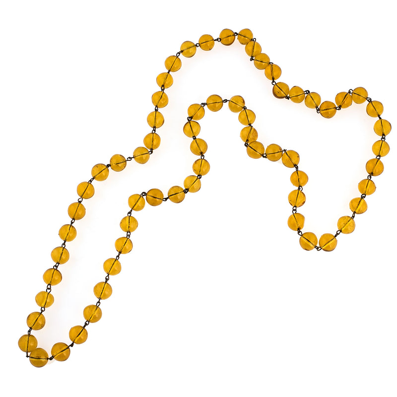 1920s Bohemian amber glass bead necklace. 40 inches.