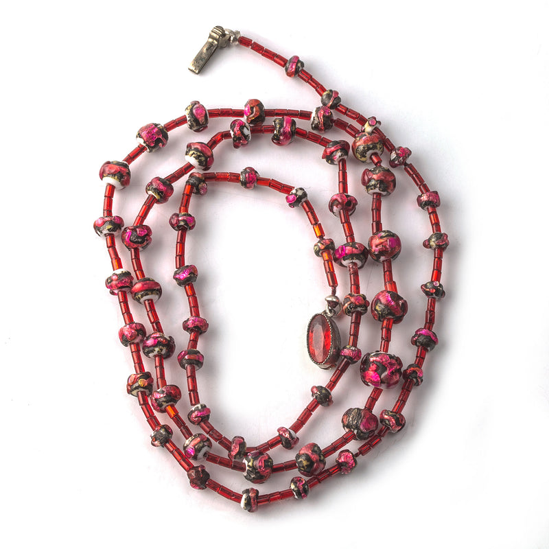 Antique Italian lava foil lampwork glass bead necklace in fuscia tones. Early 1900s. 25inches.