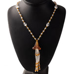Necklace of vintage Bohemian clear and amber glass beads with flower tassel