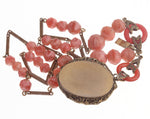 1920s Art Deco rose pink glass and brass lavalier necklace. Czechoslovakia.
