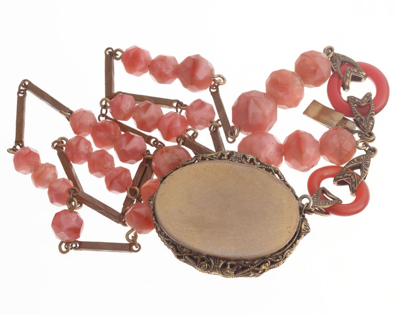 1920s Art Deco rose pink glass and brass lavalier necklace. Czechoslovakia.