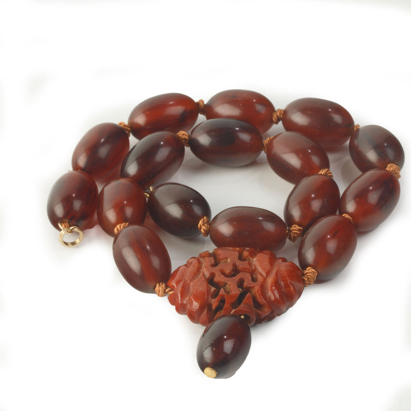 Vintage Bakelite Amber oval bead necklace with carved Bakelite focal bead