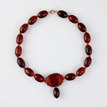 Vintage Bakelite Amber oval bead necklace with carved Bakelite focal bead