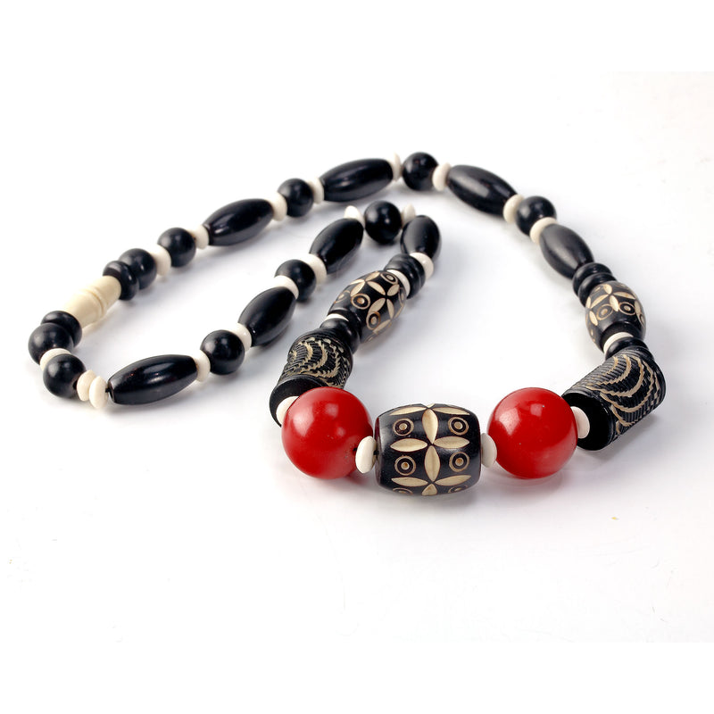 Art Deco black, cream and red carved Galalith beads necklace.  17.25 inches.