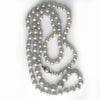 Vintage silver semi baroque Akoya pearl necklace. 33 inches