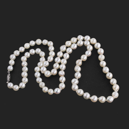 Vintage pearl necklaceJapanese Akoya semi-baroque  7mm beads 24 inches. nlfn120