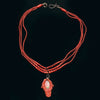 Rare Mediterranean salmon coral carving with an oval opal cabochon on the reverse, 14k rose gold metal work and a triple strand of coral beads