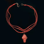 Rare Mediterranean salmon coral carving with an oval opal cabochon on the reverse, 14k rose gold metal work and a triple strand of coral beads