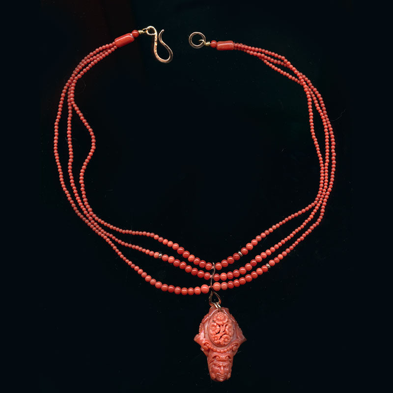 Rare Mediterranean salmon coral carving with an oval opal cabochon on the reverse, 14k rose gold metal work and a triple strand of coral beads