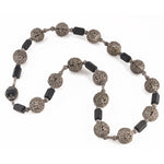 Vintage necklace with silver metal filigree beads and matte black glass beads.  23 inches