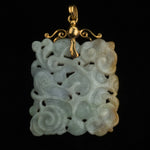 Fine jadeite carved pendant on 14k setting.