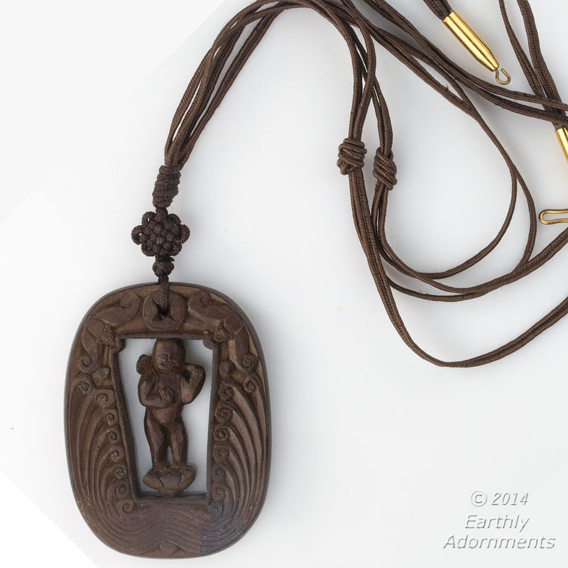 Vintage Chinese carved wood swiveling deity with two bats descending from heaven pendant