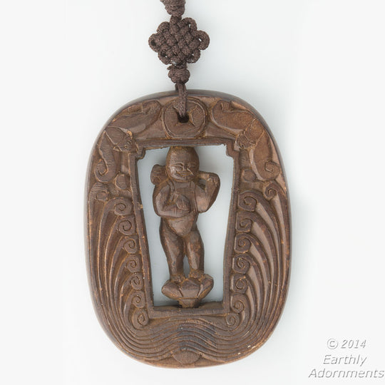 Vintage Chinese carved wood swiveling deity with two bats descending from heaven pendant. pdwd101