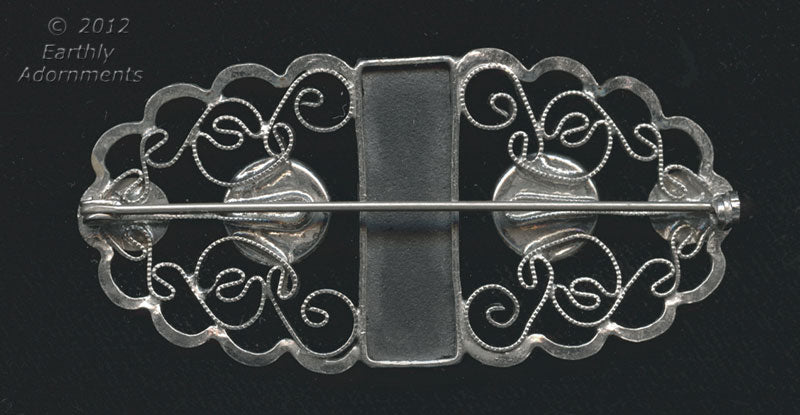 Art Deco filigree plated silver and glass brooch.