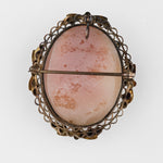 Edwardian conch shell cameo in a gold washed filigree setting.