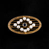 Edwardian seed pearl and sapphire oval pin or brooch in 14k yellow gold.