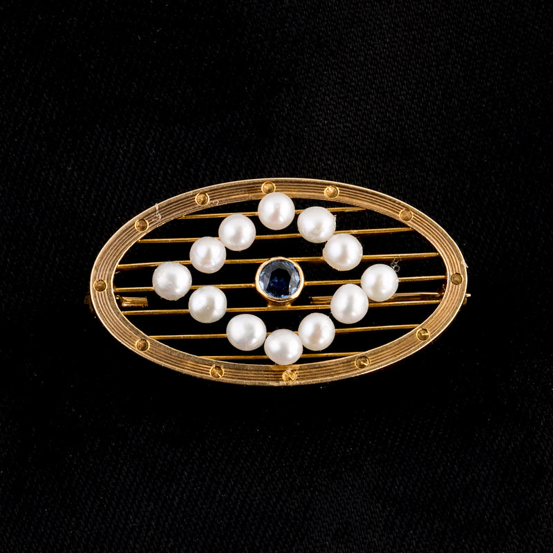 Edwardian seed pearl and sapphire oval pin or brooch in 14k yellow gold.