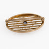Edwardian seed pearl and sapphire oval pin or brooch in 14k yellow gold.