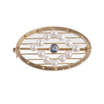 Edwardian seed pearl and sapphire oval pin or brooch in 14k yellow gold.