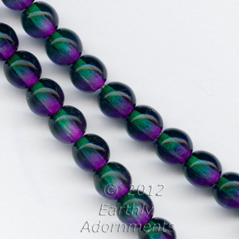 Contemporary Czech emerald and violet glass 6mm rounds, strand of 75.