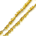 Vintage honey opalescent rocailles, size 9 on braided string per foot. 
