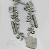 Antique large Islamic Central Asian tribal silver amulet and talisman chain necklace.